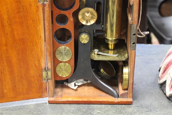A Victorian microscope by C.C. Collins, London, in mahogany case